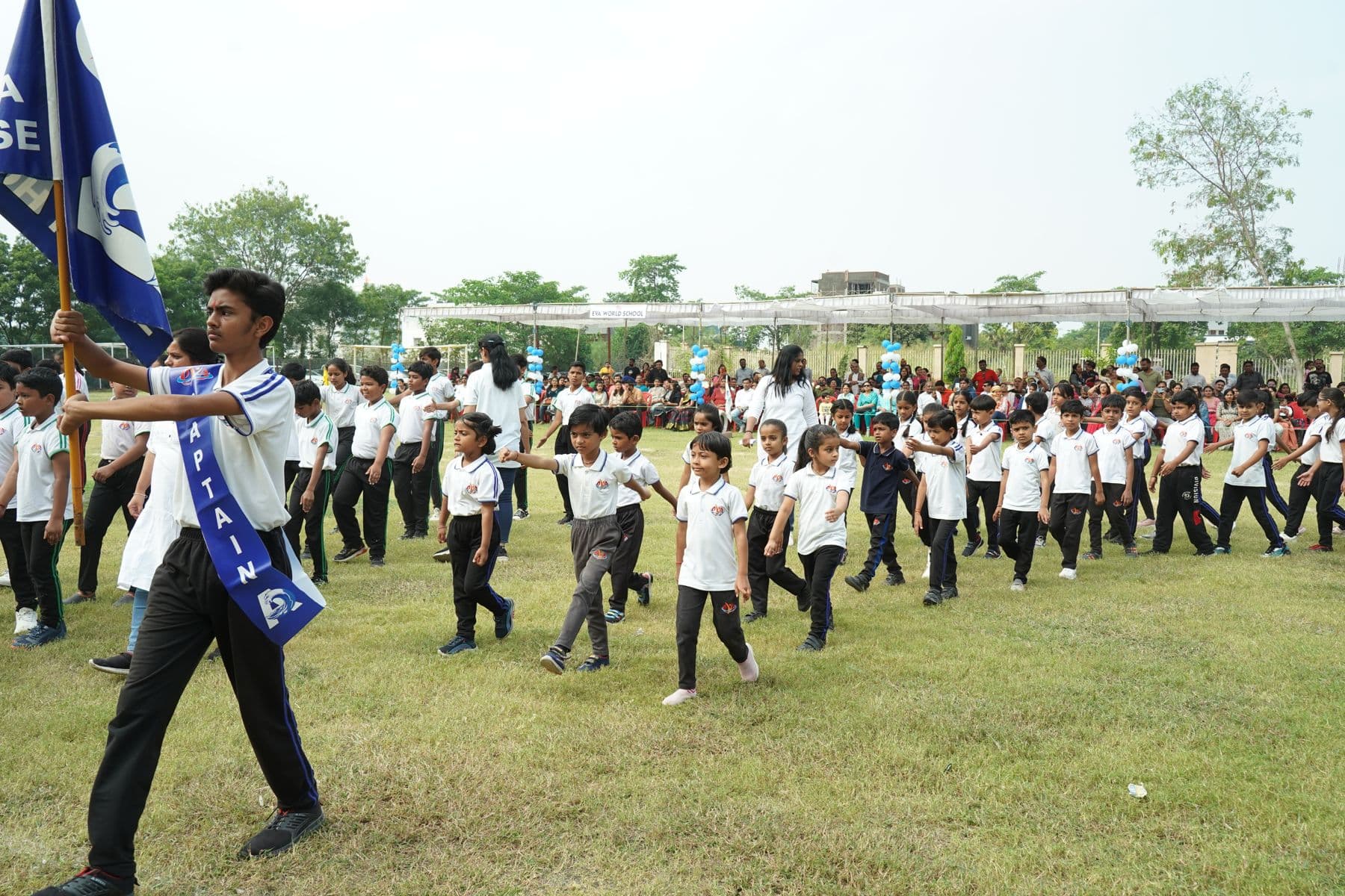 Students in formation on the school ground during an assembly