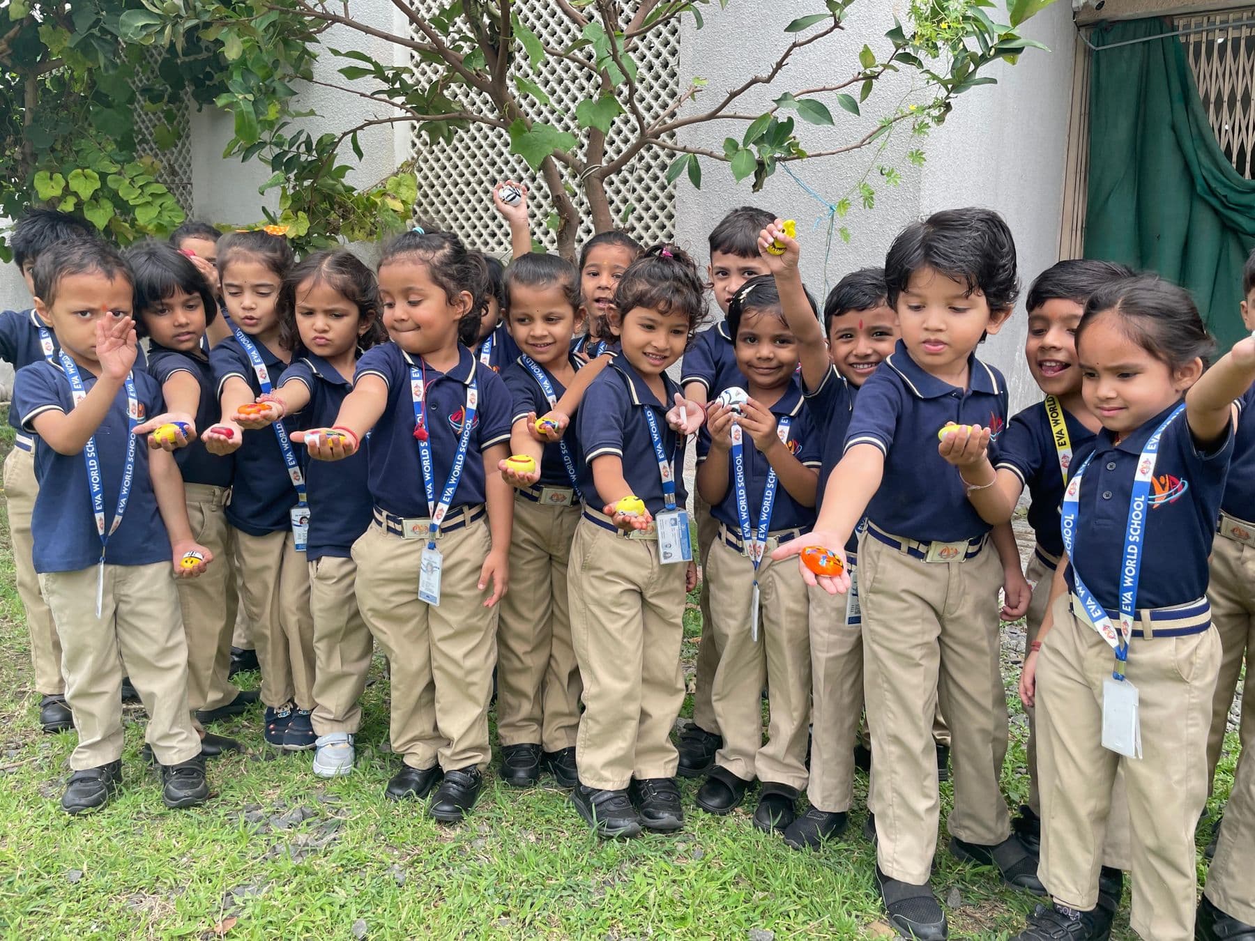 A group of Pre-Primary students in uniform standing together outdoors