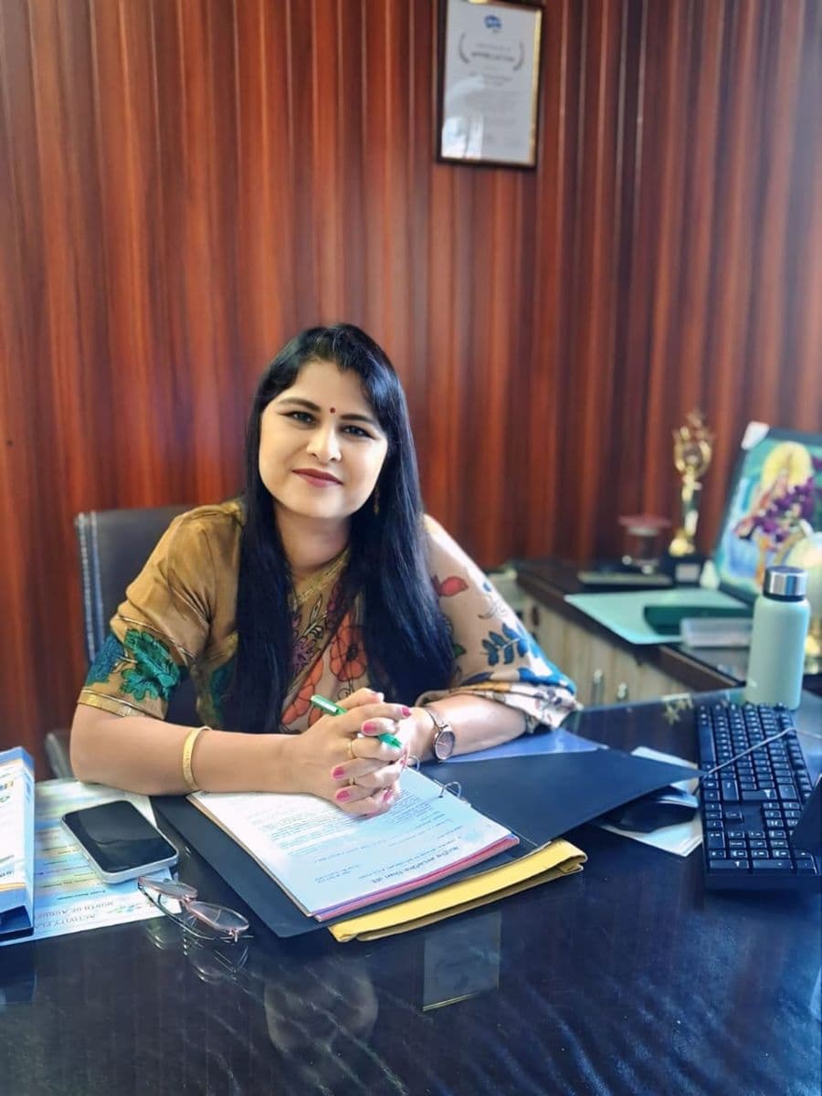 Mrs. Rachna Babel, Principal of Eva World School, Dewas, at her desk